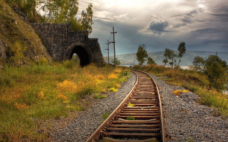 Railway track leading to tunnel