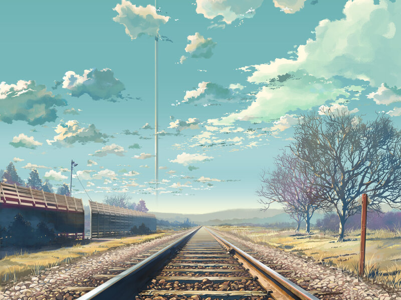 Railway track under cloudy sky