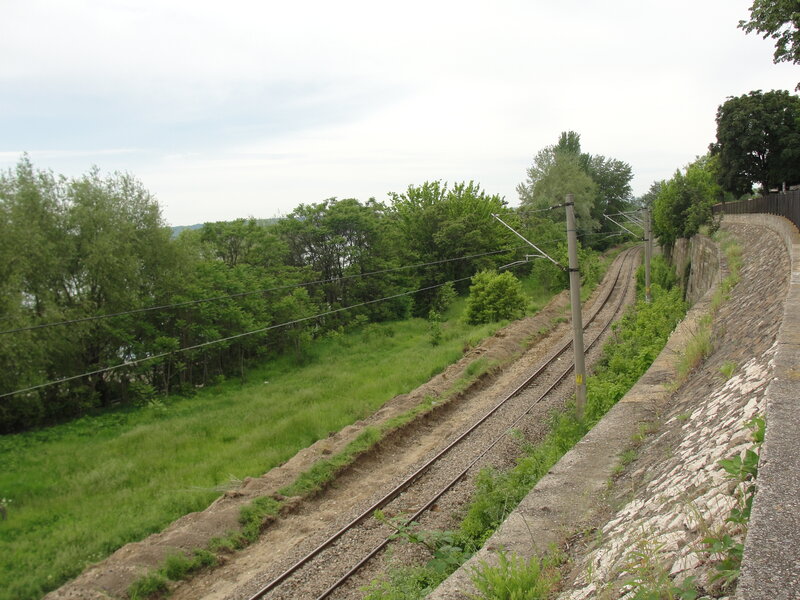 railway tracks along a green hillside