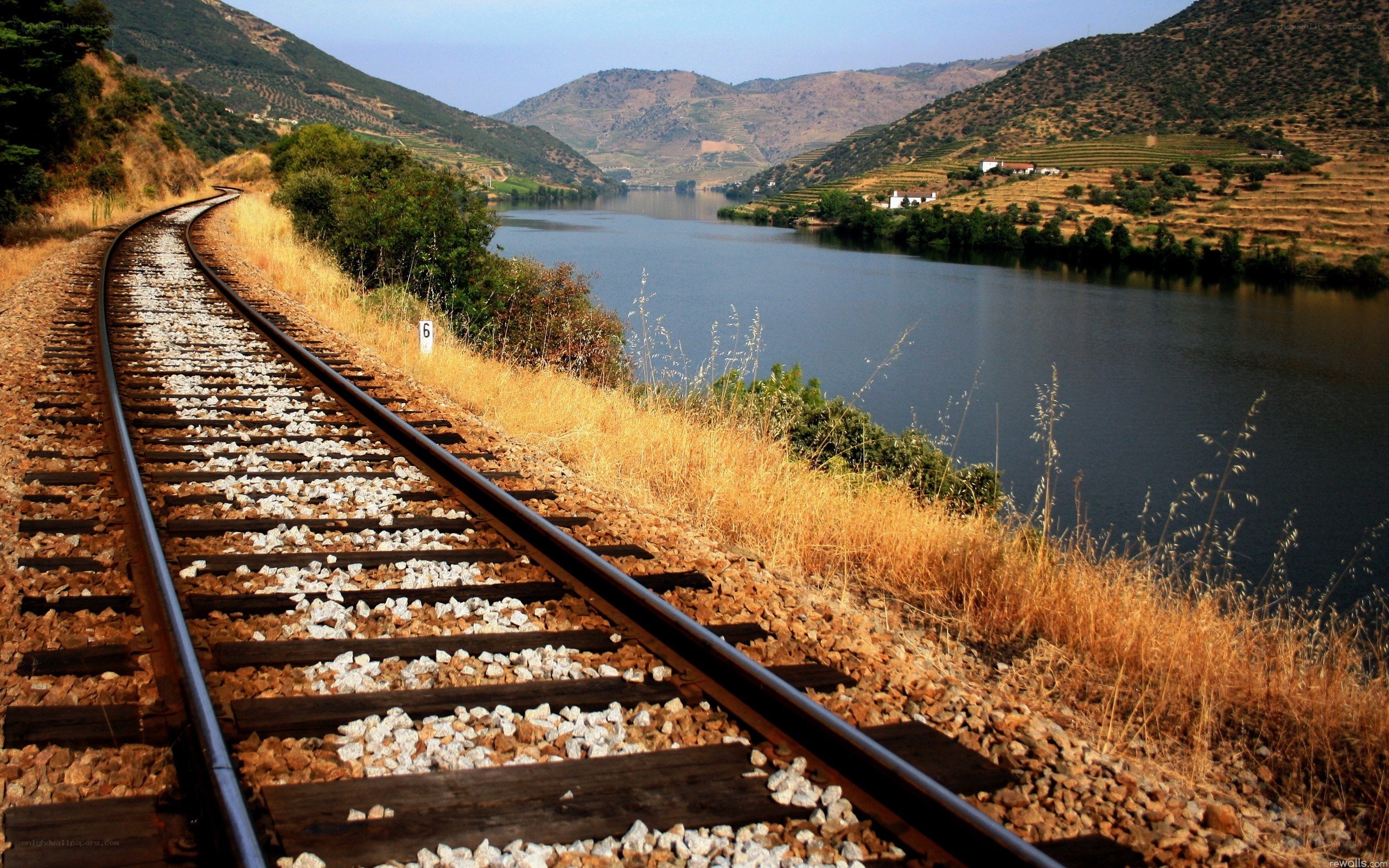 Railway tracks along a river valley