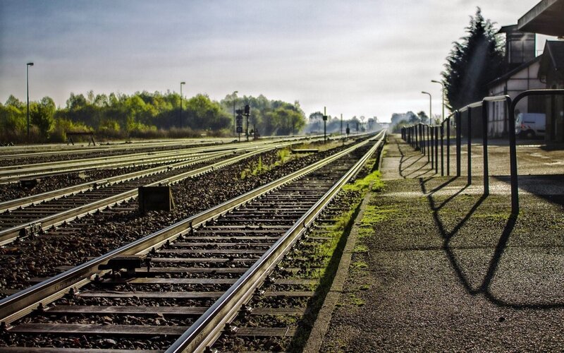 Railway Tracks at Station — Green, Serene