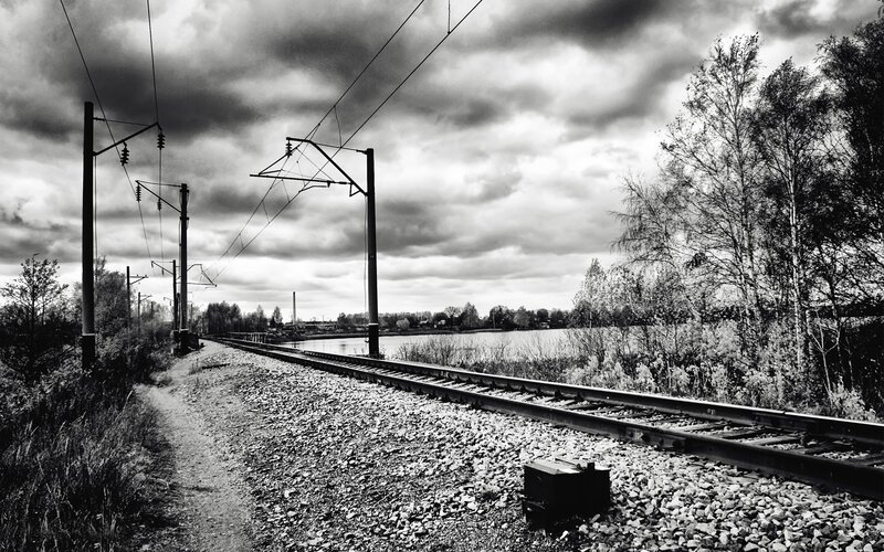 Railway tracks by a lake