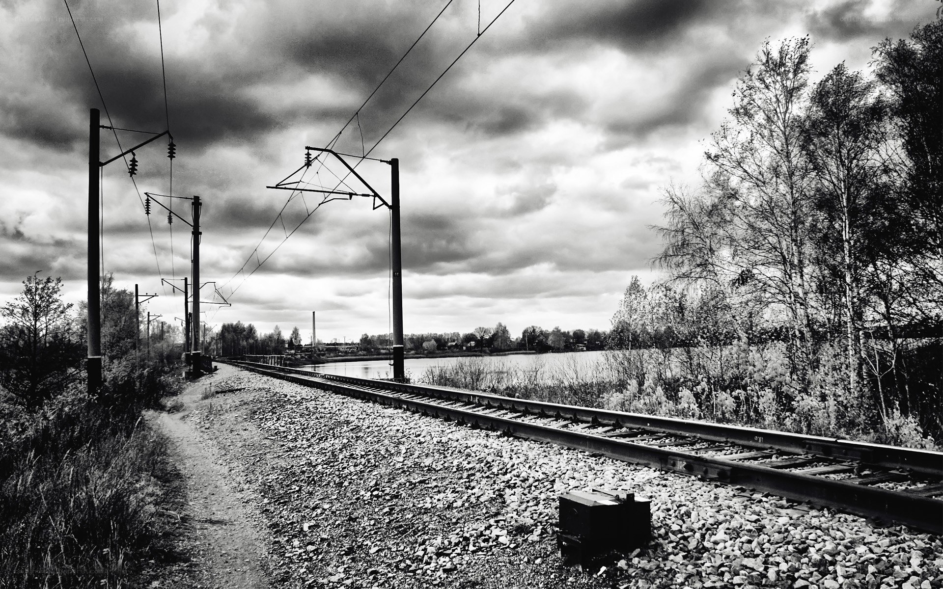 Railway tracks by a lake