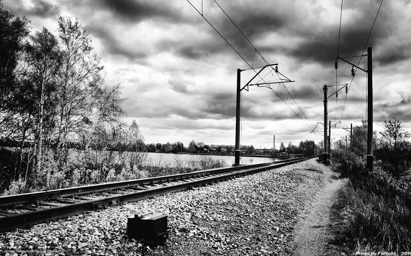 Railway tracks by a lake