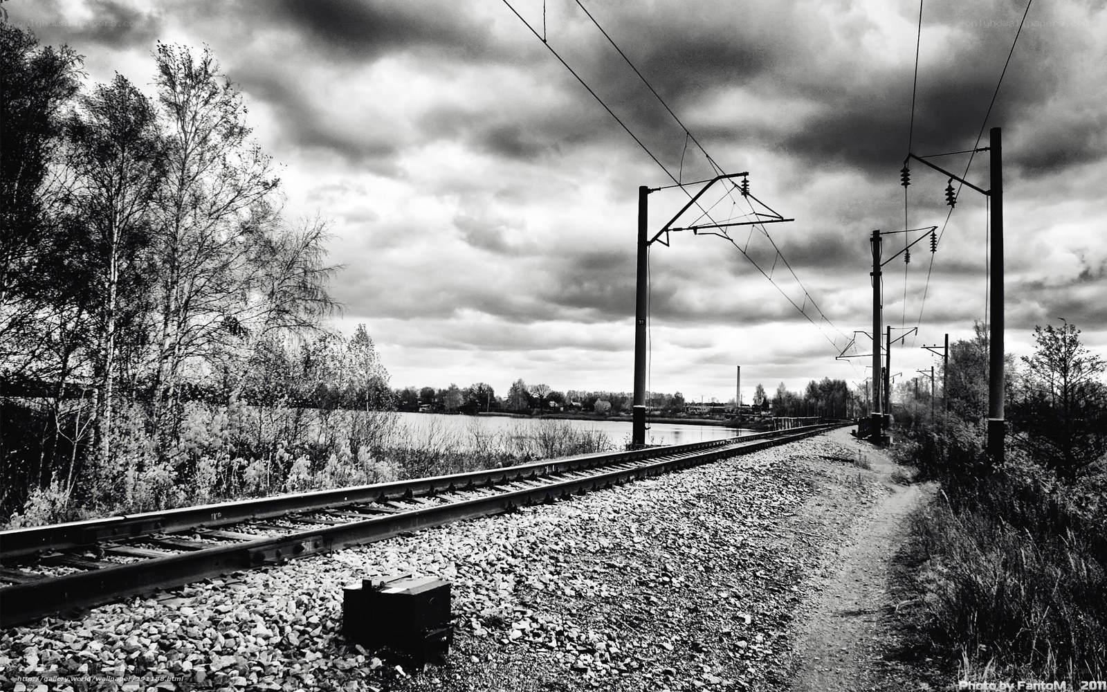 Railway tracks by a lake