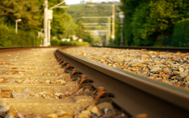 Railway Tracks in Forest — Green, Serene