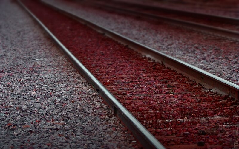 railway tracks with red gravel