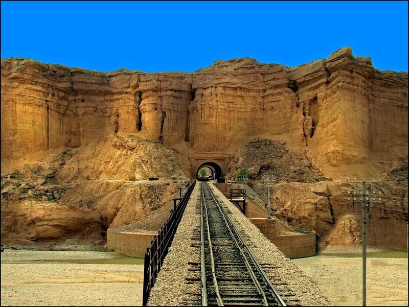 Railway tunnel in desert canyon