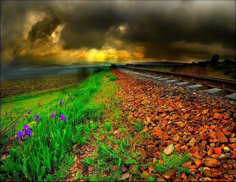 Railway under stormy sky