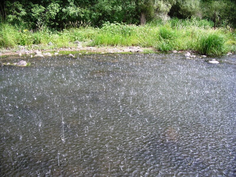 rain falling on a river
