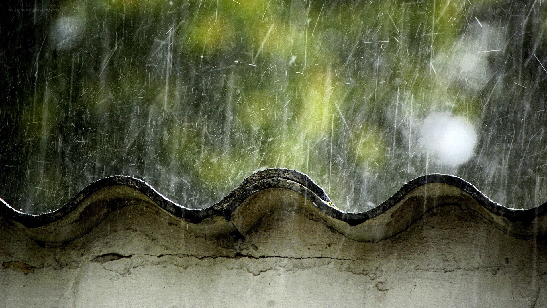 rain falling on a roof edge
