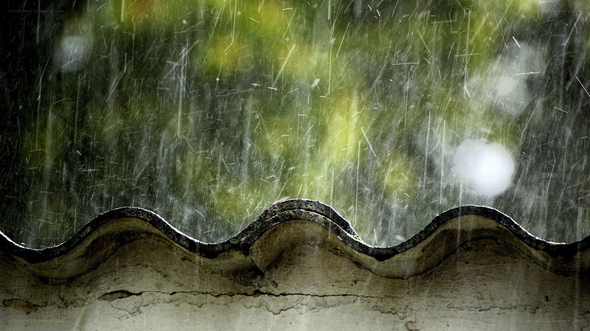 rain falling on a roof edge