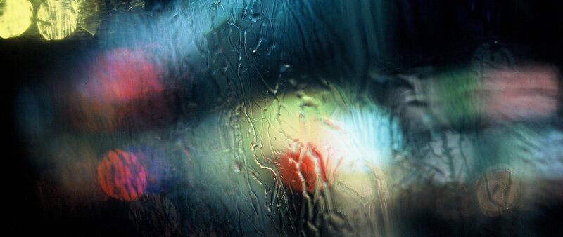 Rain-streaked Window at Night — Blue
