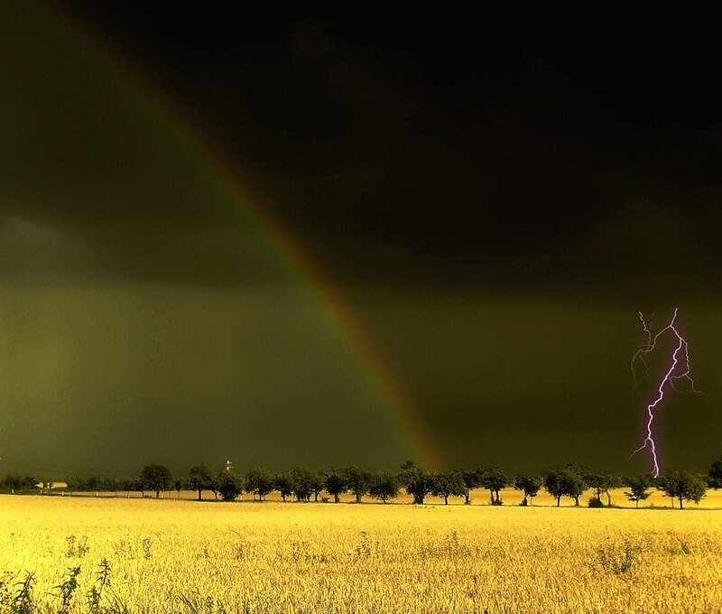 Rainbow and lightning storm