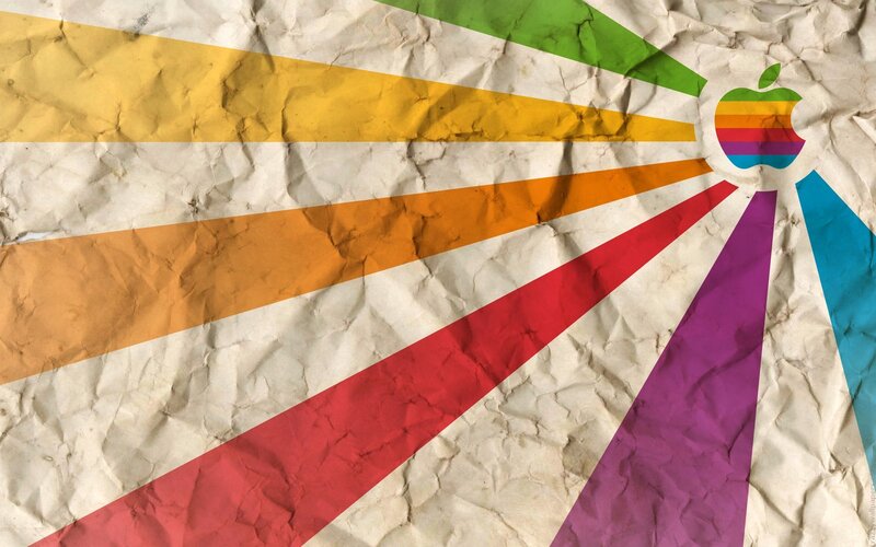 Rainbow Apple logo on crumpled paper