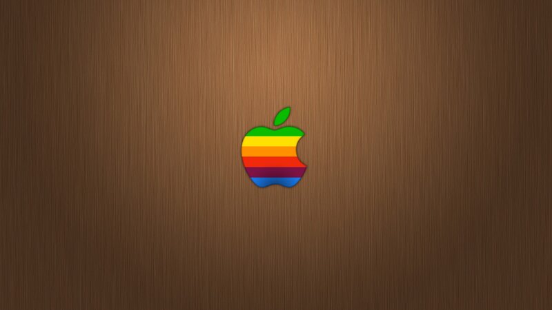 Rainbow Apple logo on wood