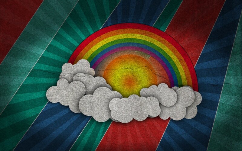 Rainbow behind clouds