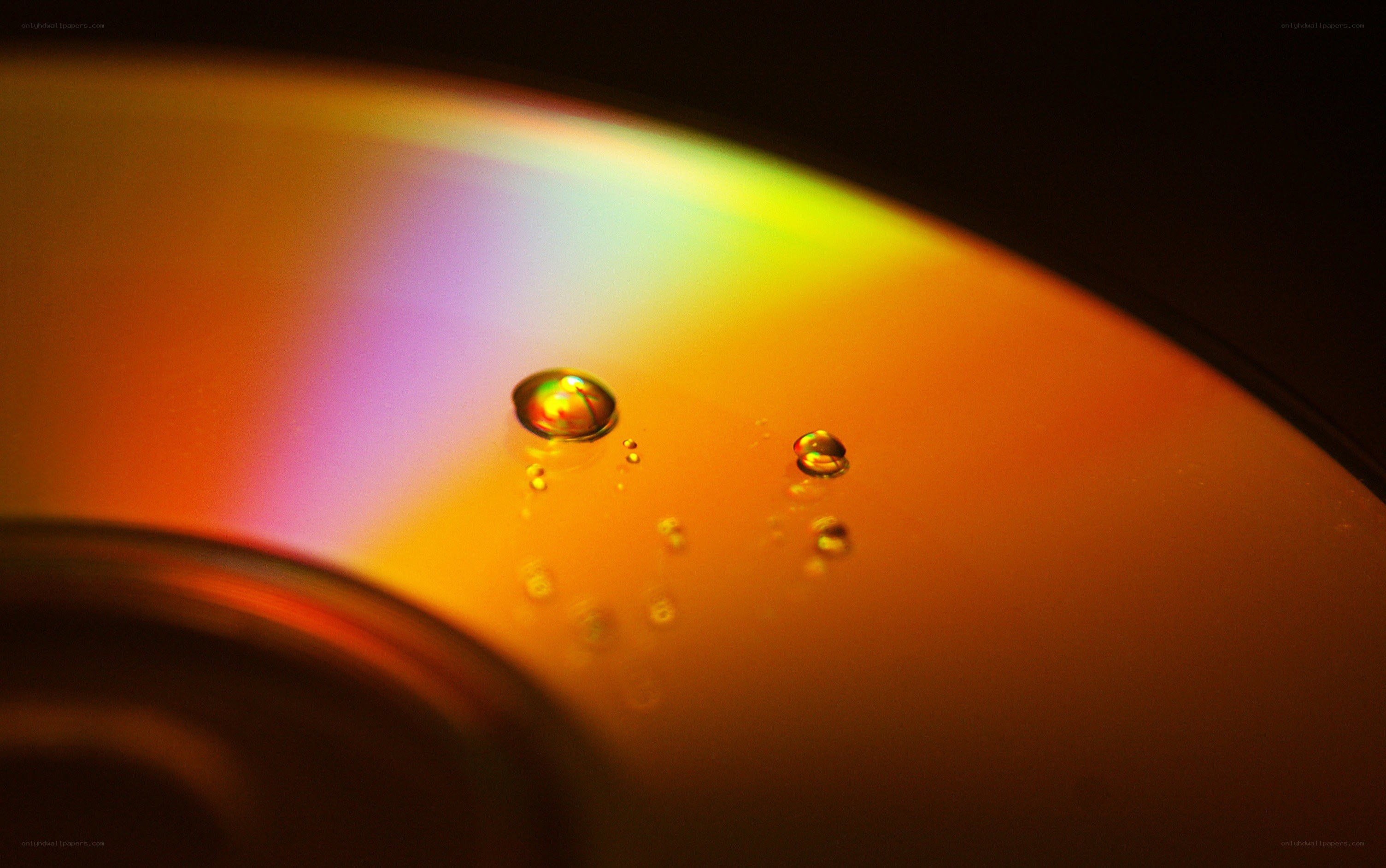 Rainbow CD with water droplets