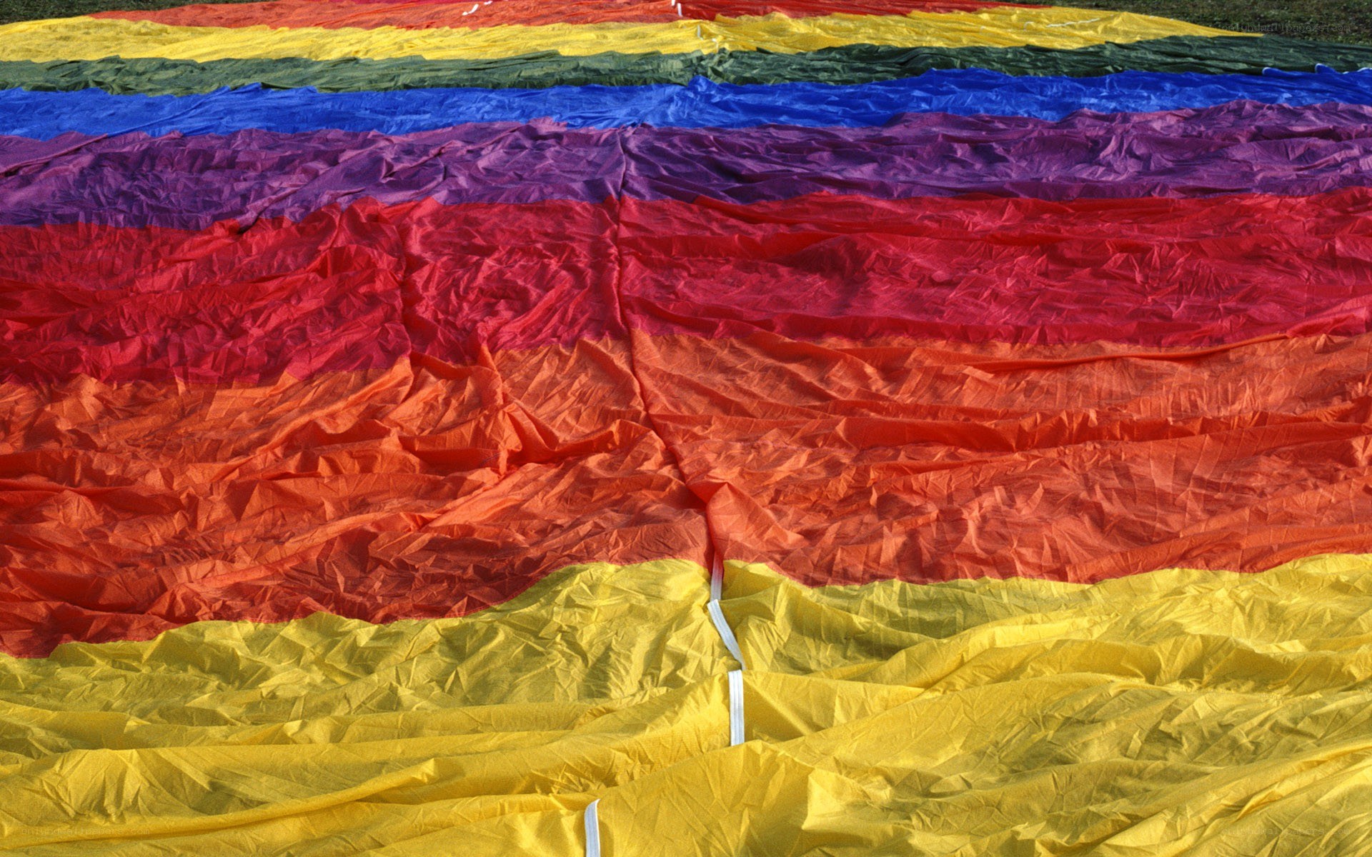 Rainbow-colored fabric laid out
