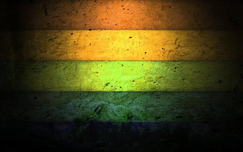 rainbow flag on concrete wall