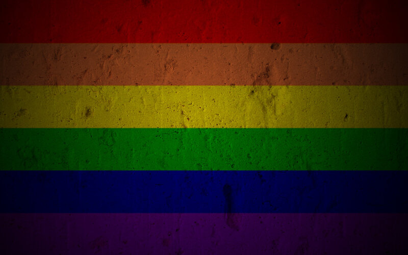 rainbow flag on textured wall
