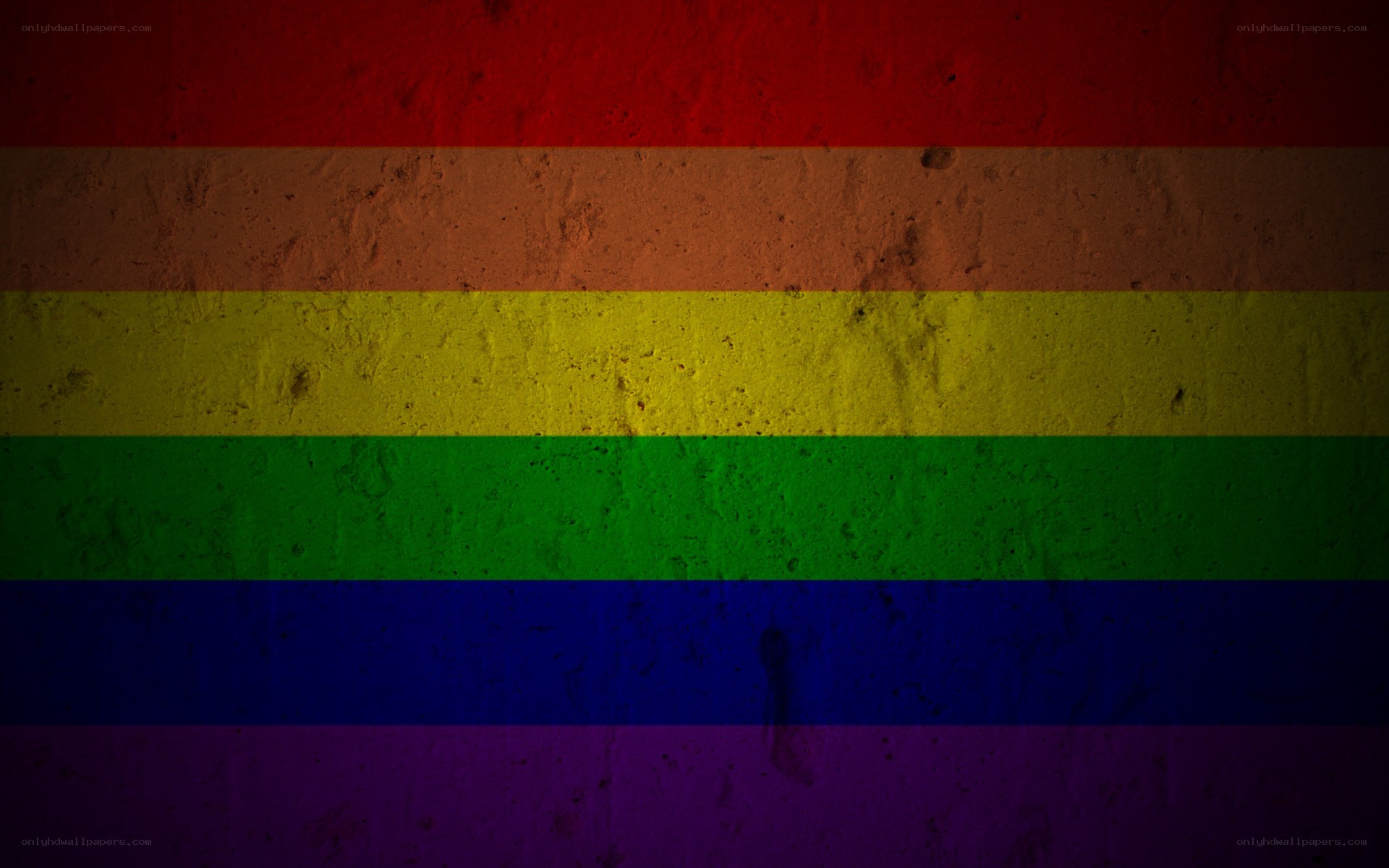 rainbow flag on textured wall