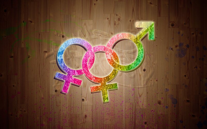 Rainbow gender symbols on wood