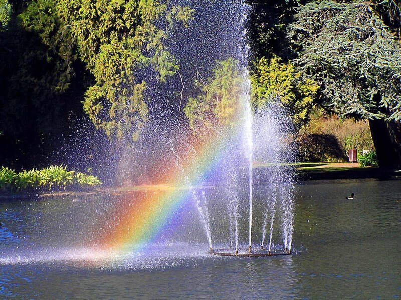Rainbow in a park fountain