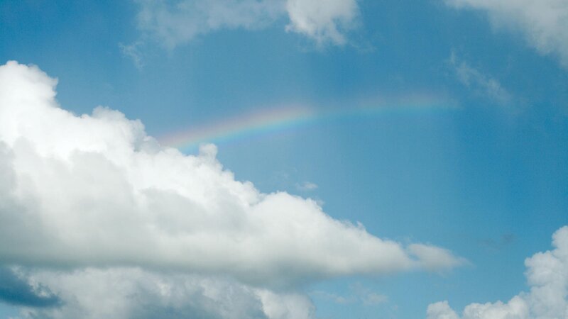 Rainbow in blue sky