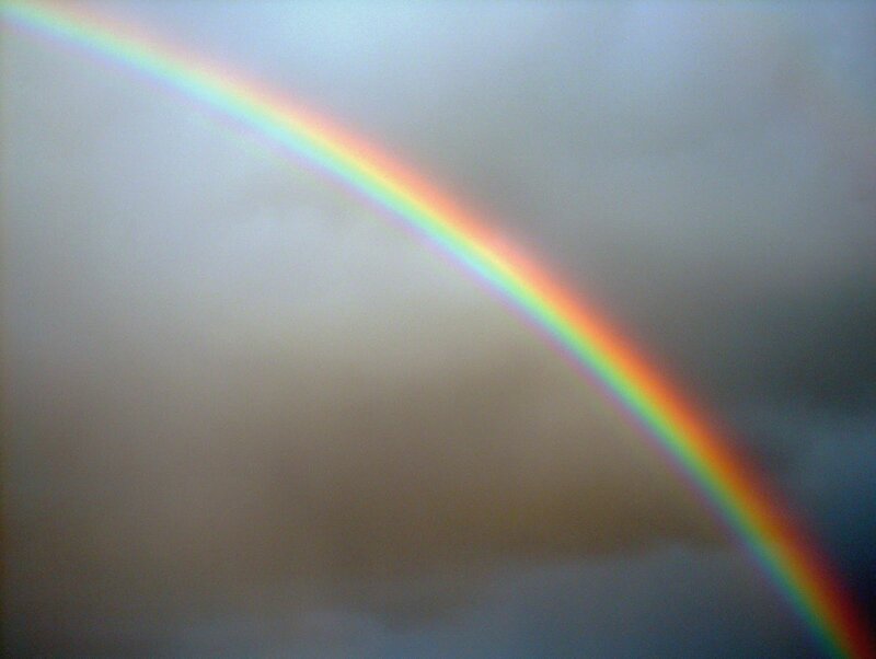 Rainbow in Cloudy Sky — Gray, Calm