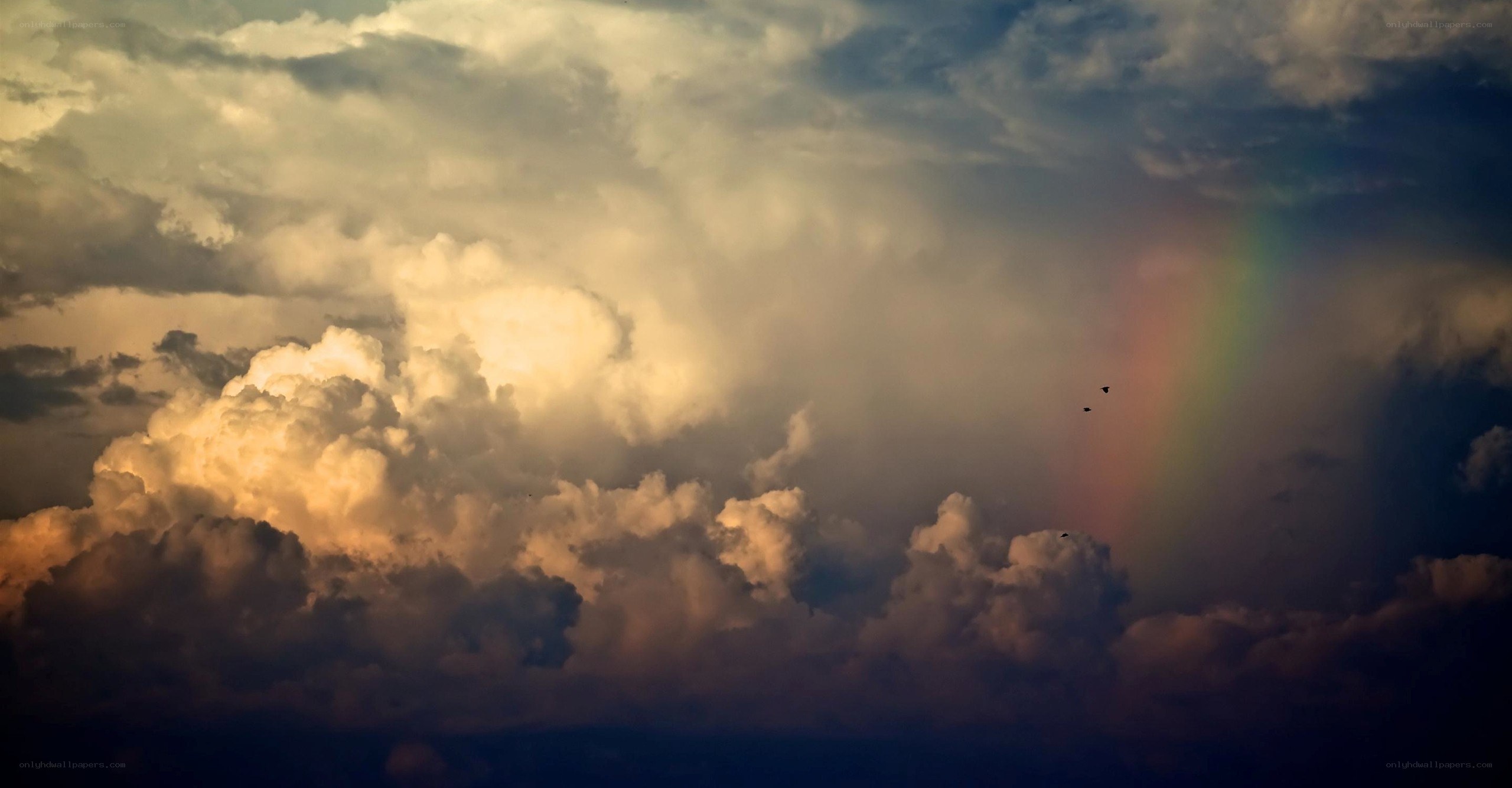 Rainbow in stormy sky