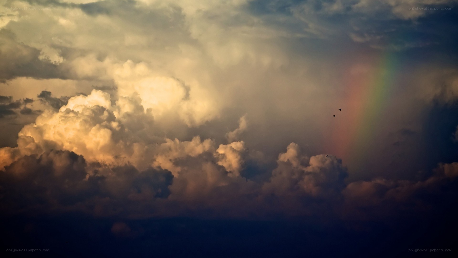 Rainbow in stormy sky
