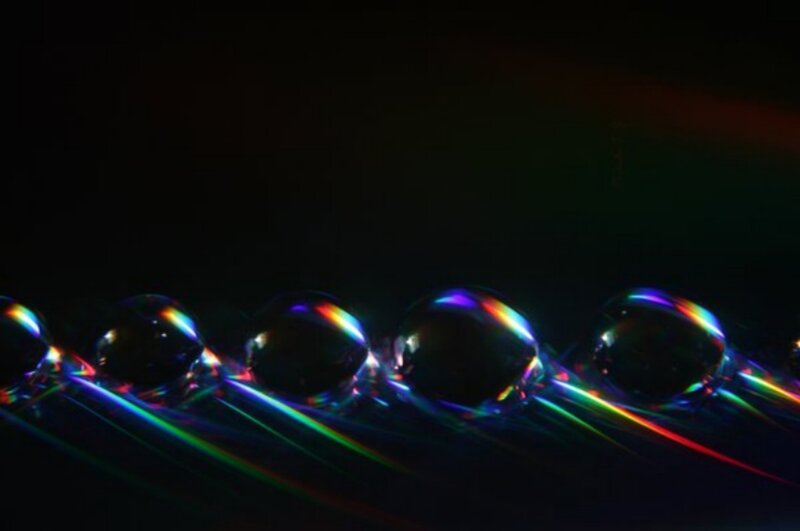 Rainbow light on water droplets