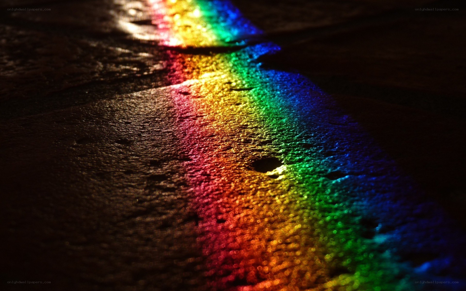 Rainbow light on wet surface