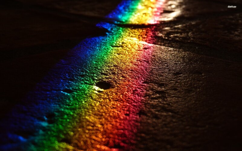 rainbow light on wet surface