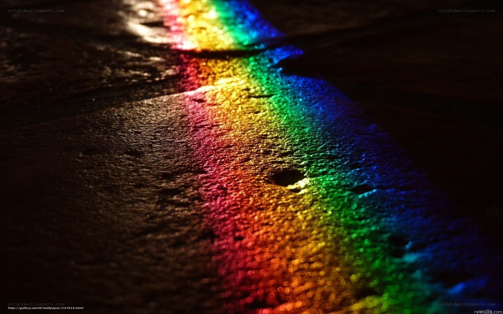 Rainbow light on wet surface
