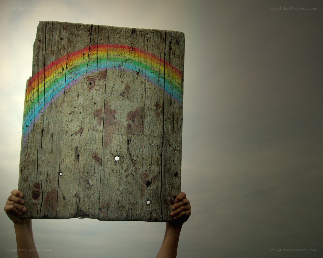 Rainbow on a wooden sign