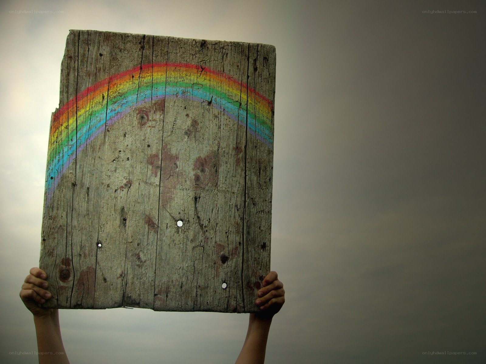 Rainbow on a wooden sign