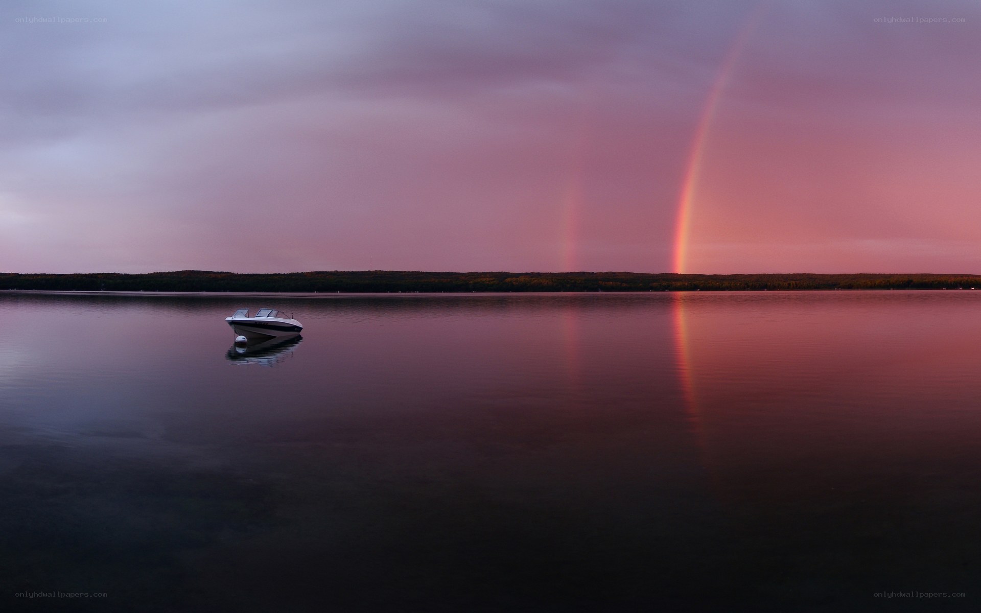 Rainbow over a calm lake