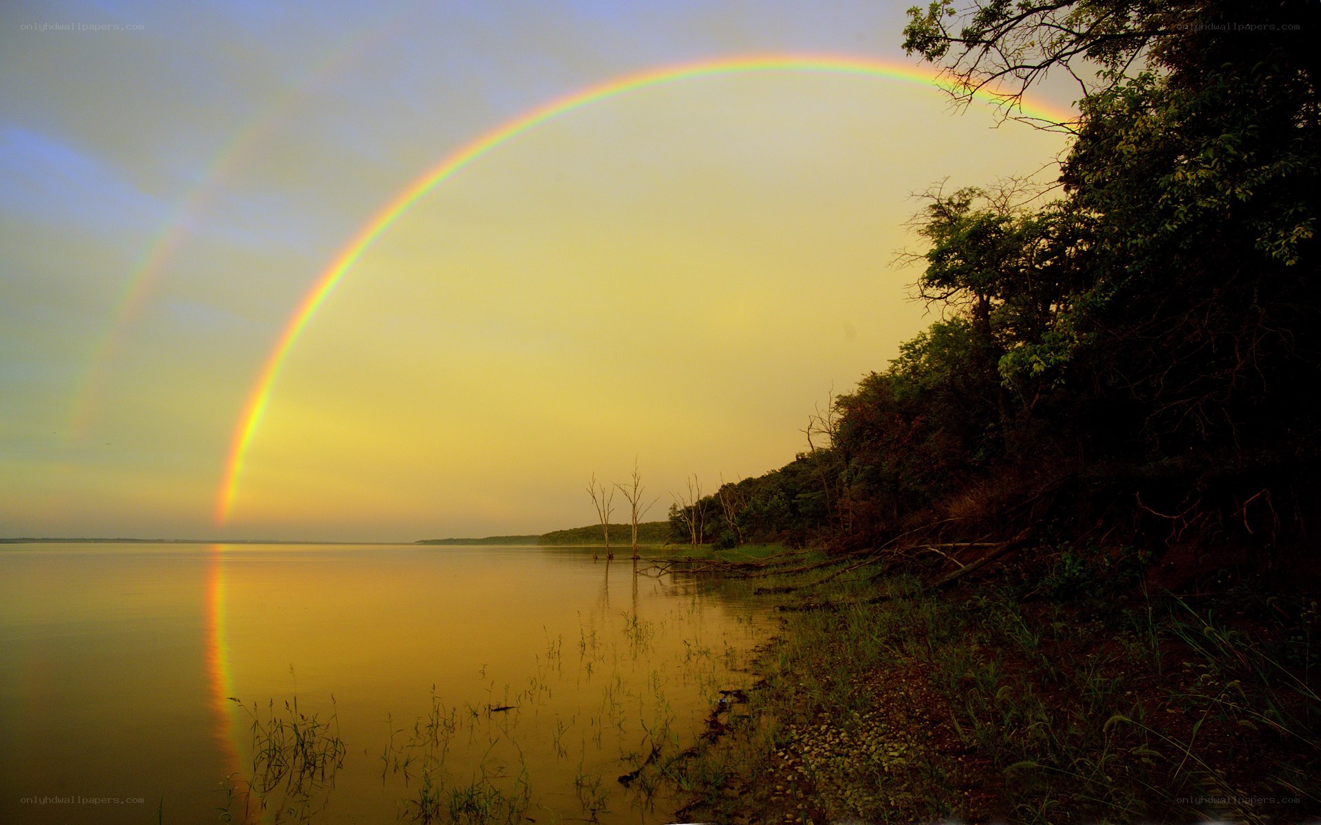 Rainbow over a calm lake