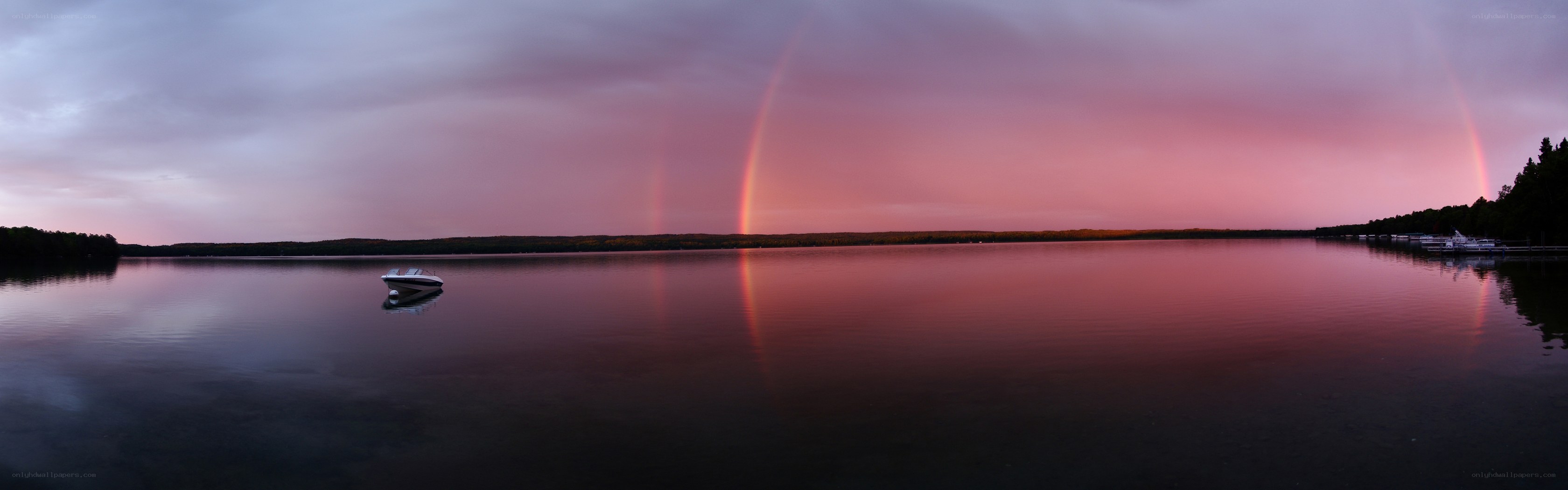 Rainbow over a calm lake
