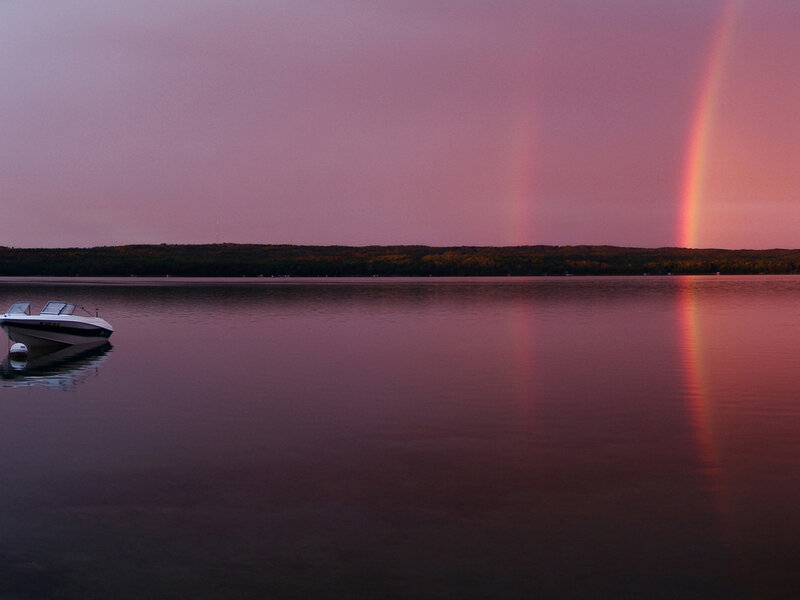 Rainbow over a calm lake