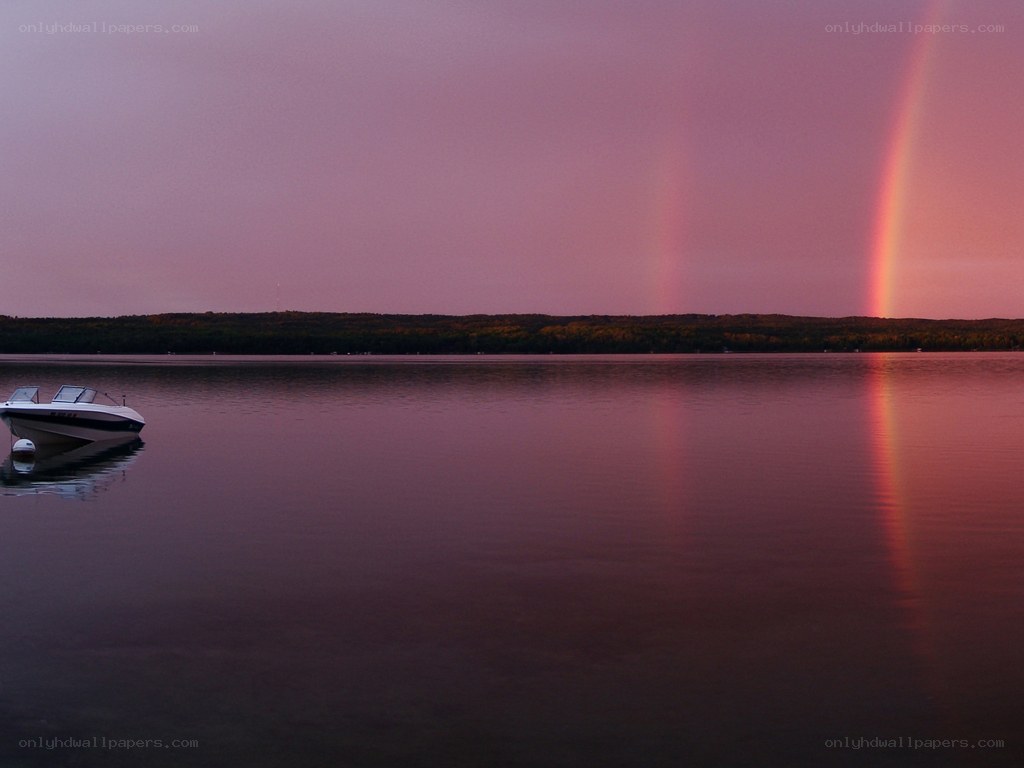 Rainbow over a calm lake