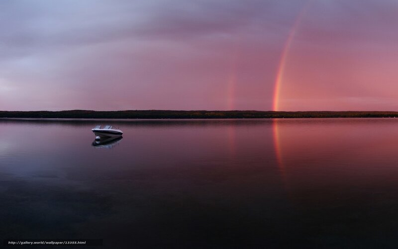 Rainbow over a calm lake