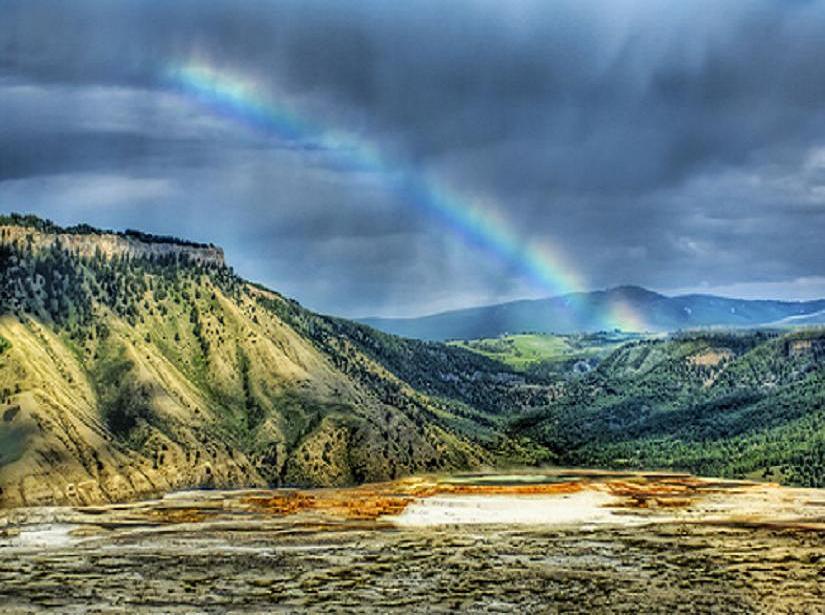 Rainbow over a canyon landscape