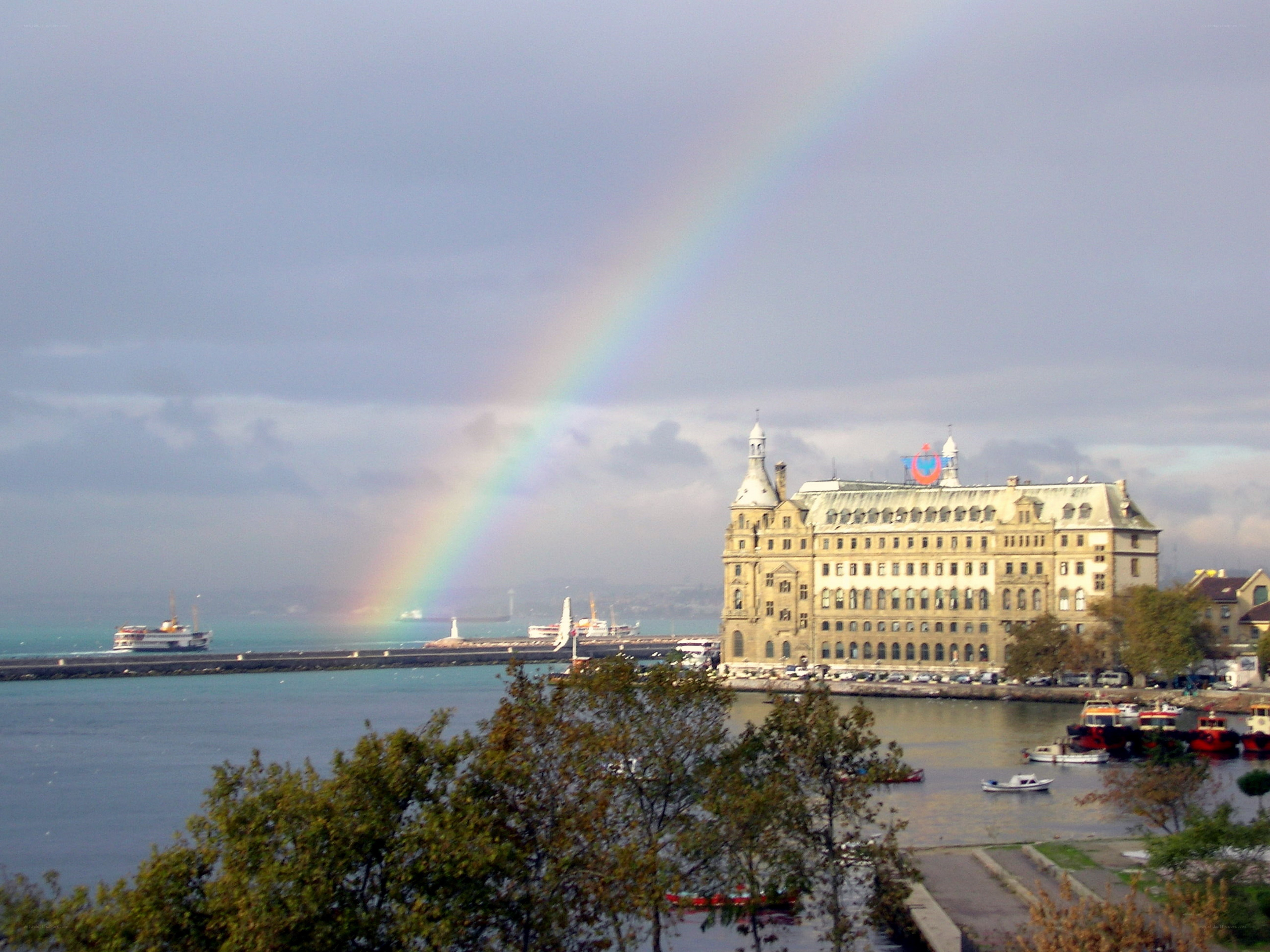 Rainbow over a coastal city