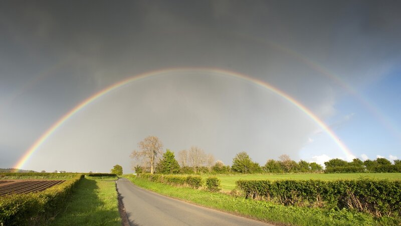 Rainbow over a country road