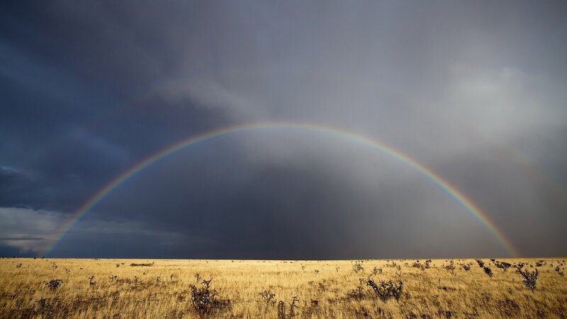 Rainbow over a desert landscape