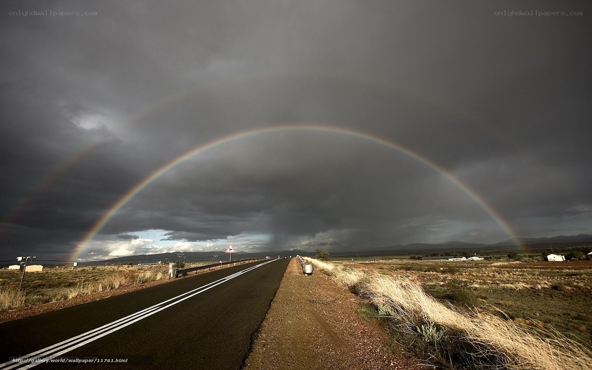 Rainbow over a desert road