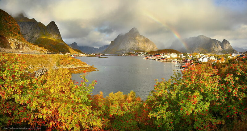 Rainbow over a fjord village